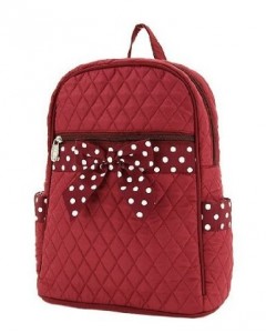 Red quilted bag with polka dot ribbon